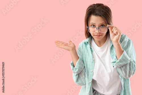 Wondering young woman showi...