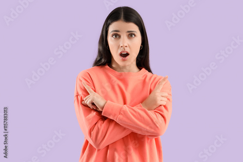 Wondering young woman point...