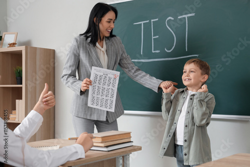 Happy schoolboy and teacher...