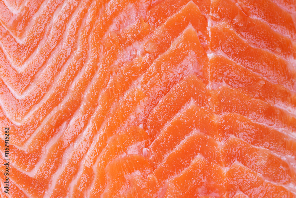 Texture background of fresh raw salmon or trout sea fish fillet macro, close up, top view. Healthy food, seafood backdrop. Texture background of fresh raw salmon or trout sea fish fillet macro, close up, top view. Healthy food, seafood backdrop.