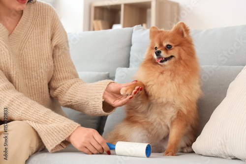 Young woman with fluffy dog...