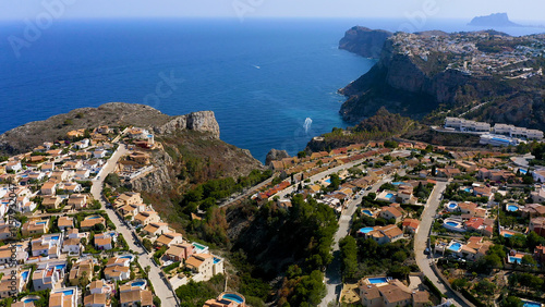 Aerial view of the chalet developments in the Cumbres del Sol, located next to the beautiful cliffs of the town of Benitachell, in the Mediterranean province of Alicante, Spain. photo