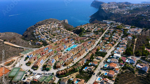 Aerial view of the chalet developments in the Cumbres del Sol, located next to the beautiful cliffs of the town of Benitachell, in the Mediterranean province of Alicante, Spain. photo