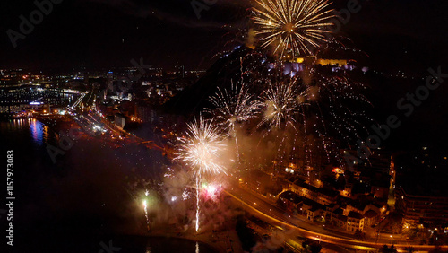 Nocturne aerial view of the fireworks launched in the beach of El Postiguet, in the Mediterranean city of Alicante, Spain. photo