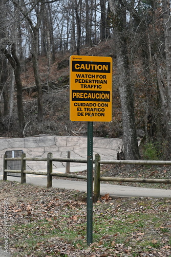 Caution Watch for Pedestrian Traffic sign in English and Spanish