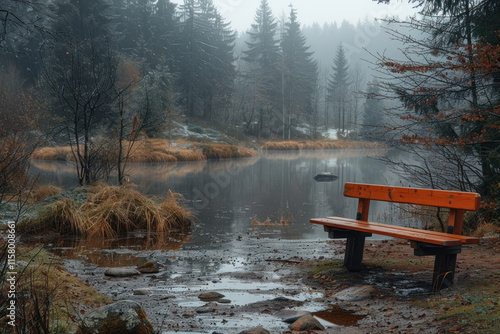 peaceful and melancholic autumn landscape. Bench by the water..      photo