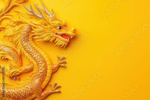 Golden dragon with glitter accents on vibrant yellow background photo