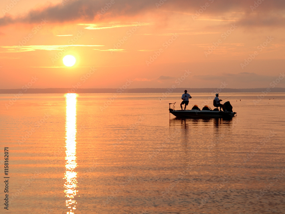 Early Fishermen in Boat on Lake at Sunrise Early Fishermen in Boat on Lake at Sunrise