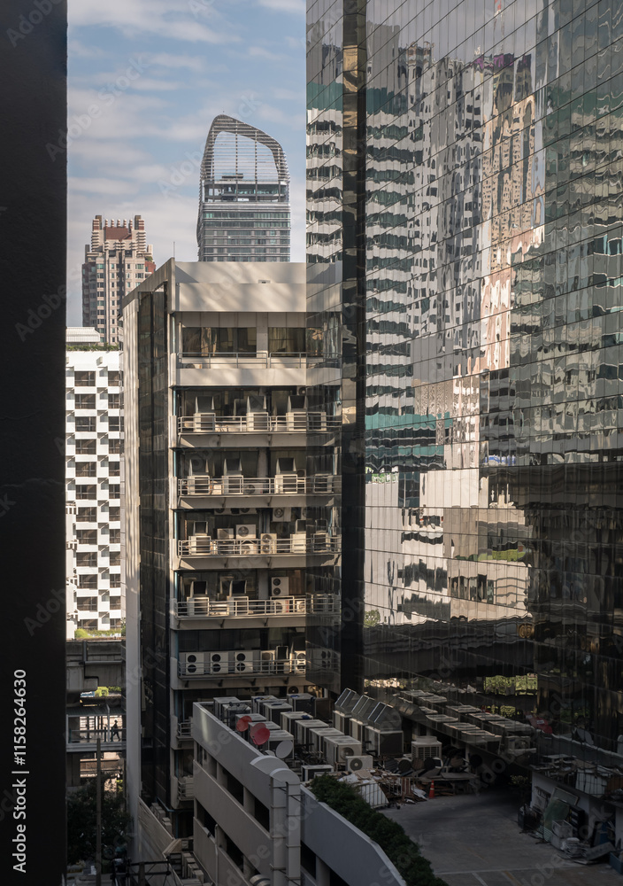 Beautiful view of modern building in the city ??center of bangkok. Steel frame and glass windows architecture, use it as your Wallpaper, Poster and Space for text, Selective focus.