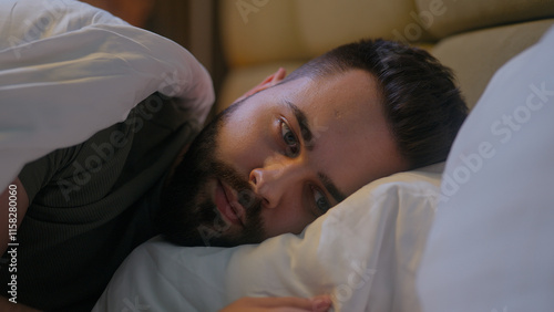 Billede på lærred Caucasian man lying in bed bedroom insomnia frustration thoughtful anxiety male