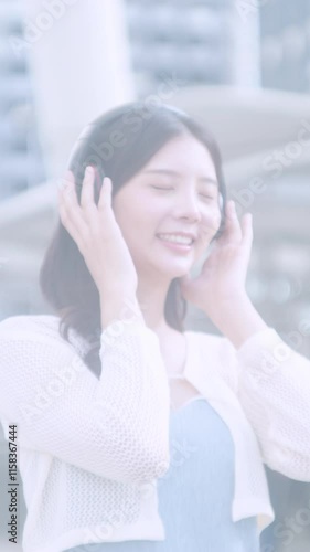 Asian woman is taking notes on a tablet.