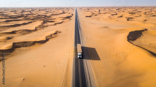 Aerial view of a truck on a long desert road. photo