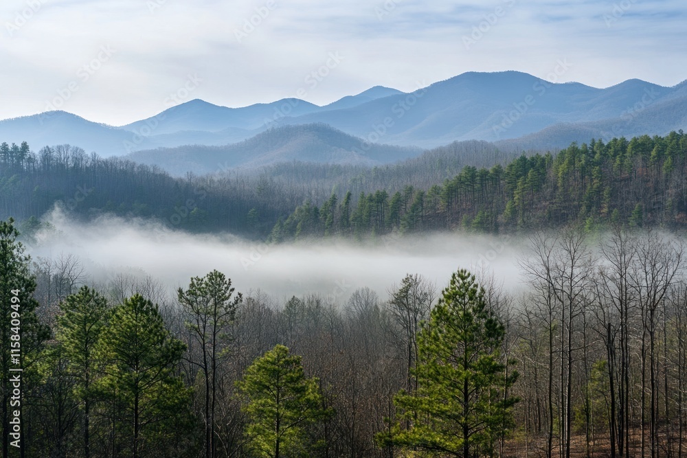 Misty mountain landscape with layers of blue mountains and fog covering valley. Misty mountain landscape with layers of blue mountains and fog covering valley.