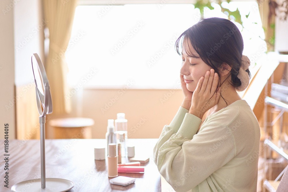 Fototapeta premium スキンケアをしている若い女性。