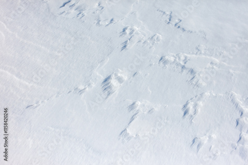 The snow is white and the ground is covered in it