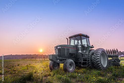 Farm Tractor in a field on a Maryland Farm at sunset