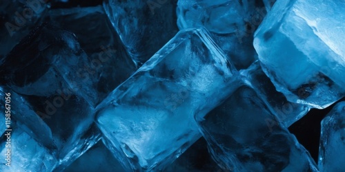 Closeup of assorted ice cubes in varying sizes and shapes, featuring deep blue hues with rough textures and dark background. photo