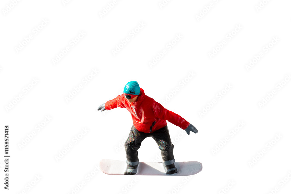 Miniature figurine depicting a snowboarder in mid-motion isolate on white background with clipping path Miniature figurine depicting a snowboarder in mid-motion isolate on white background with clipping path