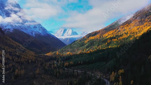 Witness breathtaking aerial views of Mount Siguniang in Shuangqiao Valley with vibrant autumn colors and stunning landscapes photo