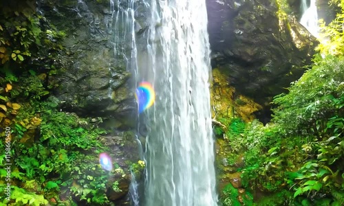 Cascading Water Over Moss-Covered Rocks
 photo