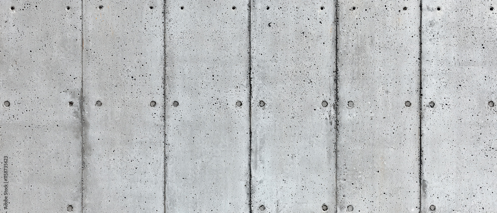 Concrete construction. Concrete wall with textured panels and visible fasteners. Concrete construction. Concrete wall with textured panels and visible fasteners.