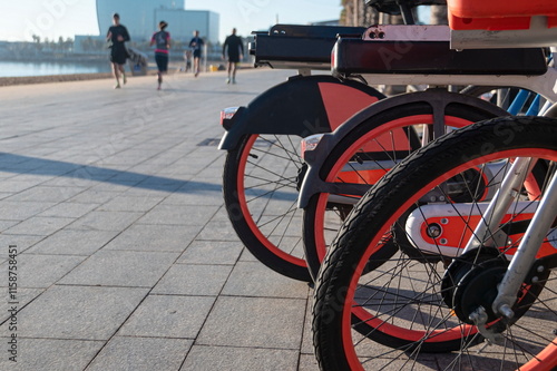 Rental municipal bicycles on a Barceloneta promenade in Barcelona, Spain.