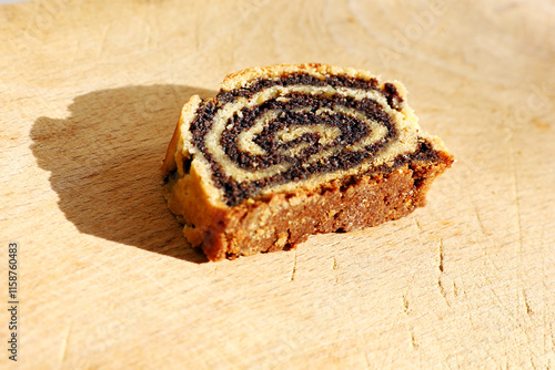  Traditional Hungarian Homemade Christmas Beigli or Bejgli Cake on Wooden Board. Holiday Background photo