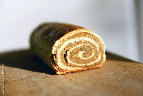  Traditional Hungarian Homemade Christmas Beigli or Bejgli Cake on Wooden Board. Holiday Background photo