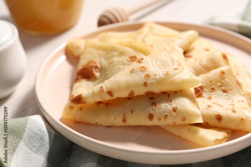 Delicious folded crepes on table, closeup view Delicious folded crepes on table, closeup view