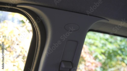 Safety airbag sign on center pillar panel in car, closeup