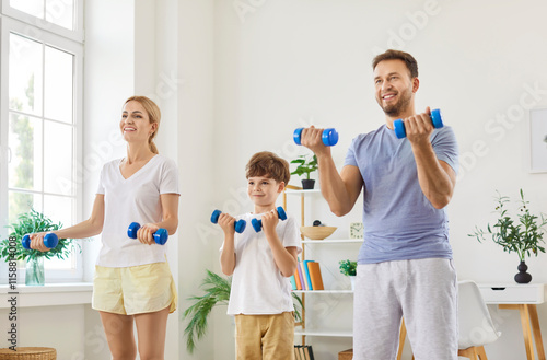 Sporty happy active young family doing morning training, beautiful sporty healthy people, enjoy fitness exercises with dumbbells, workout at home, doing weight training, friendly parent and small kid photo