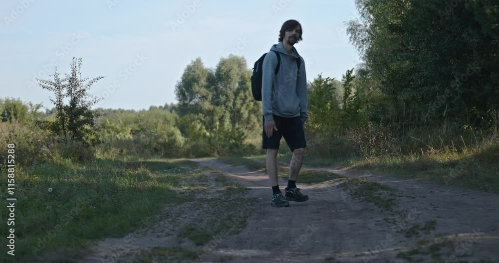 Happy Caucasian Man Waves Hand Greeting Gesture While Walking. Slow motion 60fps 4K 10-bit Happy Caucasian Man Waves Hand Greeting Gesture While Walking. Slow motion 60fps 4K 10-bit
