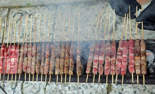 skewers of lamb, a typical dish of Central Italian cuisine, grilled over an open flame called ARROSTICINI photo