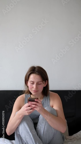 Modern Connectivity: Woman on Phone in Bed