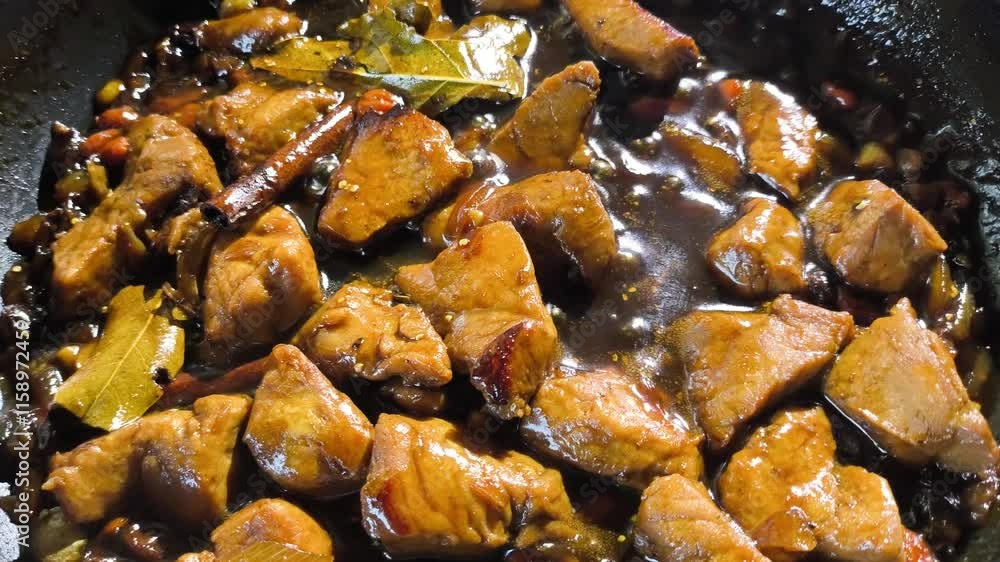 Stewing chopped pork with sauce in pan, in door Chiangmai Thailand. Stewing chopped pork with sauce in pan, in door Chiangmai Thailand.