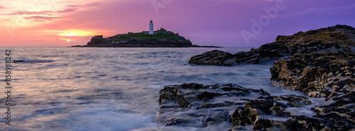 Sunset on Godrevy Island Lighthouse, Cornwall photo