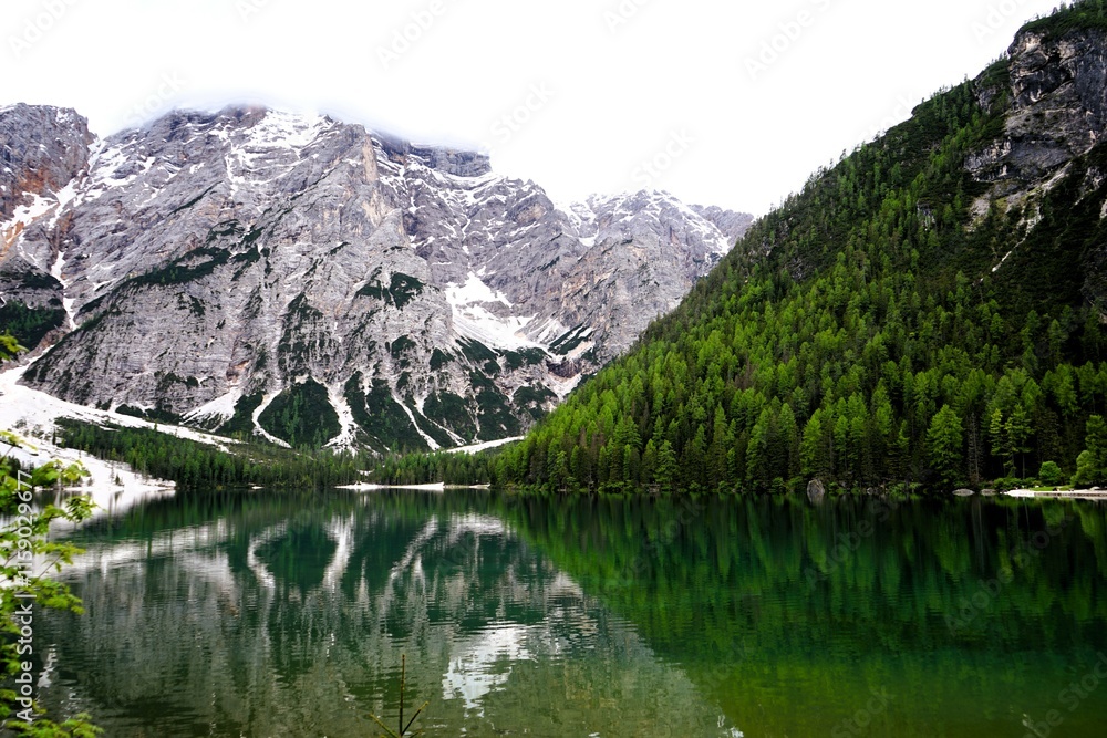 Fototapeta premium Beautiful landscape panorama of the Pragser Wildsee, Lake Prags, Lake Braies, Lago di Braies, Pragser Wildsee in the Dolomites in South Tyrol, Italy. Hiking and holidays in South Tyrol.