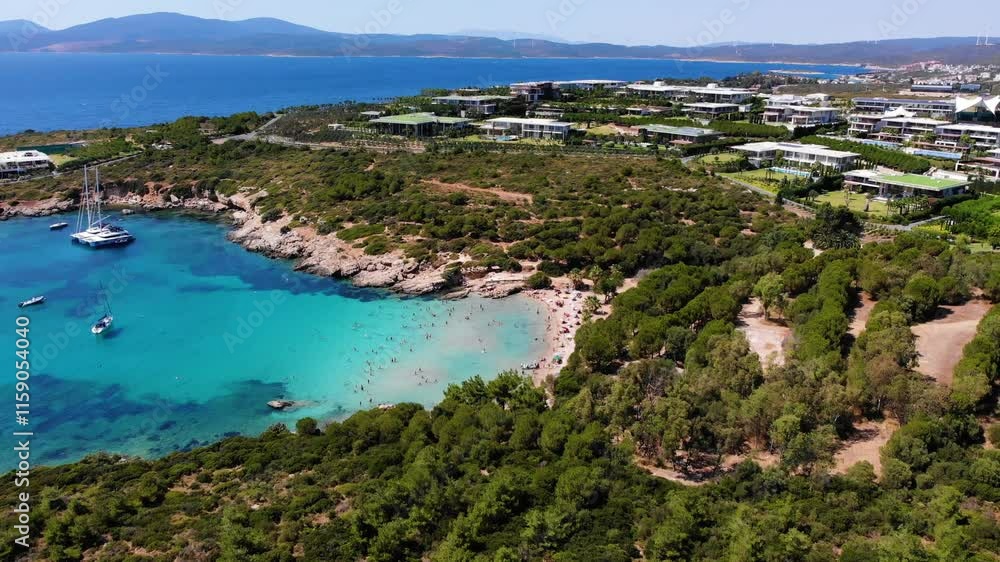People swimming in the sea and sunbathing on the beach on the Turkish coast - Turkey's Maldives - Aerial shot of Izmir coast and beach with drone People swimming in the sea and sunbathing on the beach on the Turkish coast - Turkey's Maldives - Aerial shot of Izmir coast and beach with drone