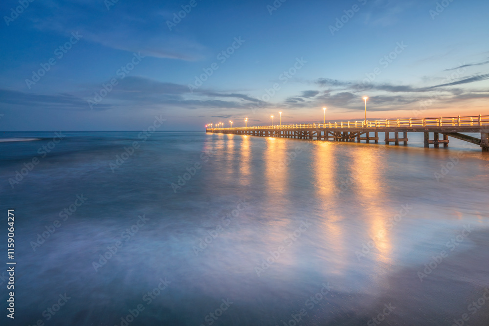 Obraz premium The pier of Forte dei Marmi at sunset. Versilia, Tuscany, Italy