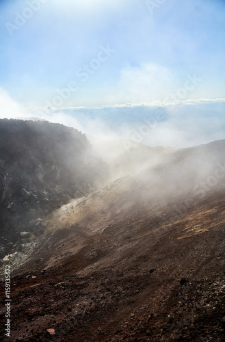 Avachinsky volcano crater. Avachinsky volcano. The diverse and captivating volcanic terrain features vibrant, colorful hills and a dramatic, smoky crater eruption photo