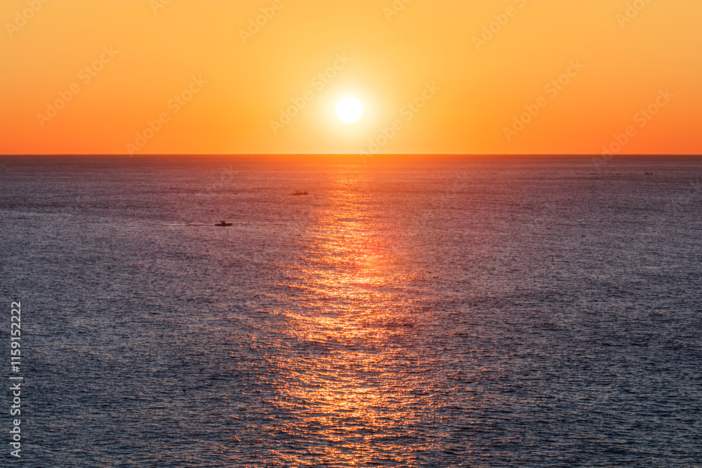 Fototapeta premium Sea sunrise landscape. rising sun - Ripples sparkle as sunlight shines on the morning sea. Yunseul