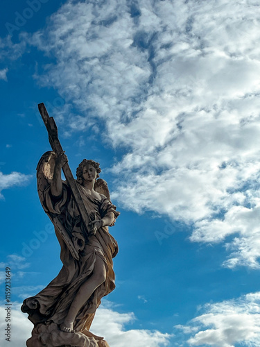 Sticker statue of the angel on sky background