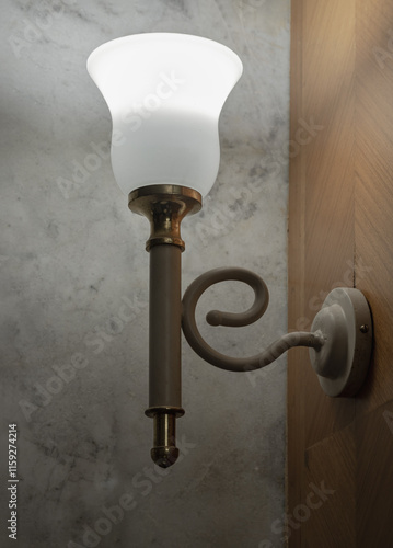 Obraz na płótnie Old vintage lamp illuminated on the wooden wall (uplighter). Classic metal wall lamp, Lamp create a warm and elegant ambiance, perfect for vintage-themed, use it as your Wallpaper, Poster and Space. w salonie