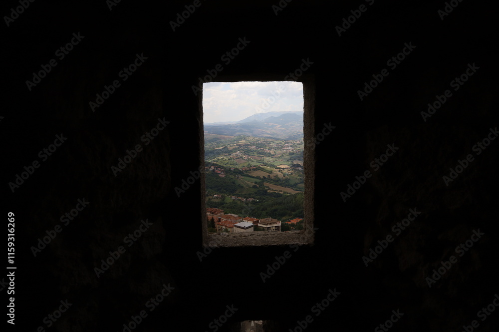 The picture depics the sight from a medieval window of a castle on an italian countryside. The picture depics the sight from a medieval window of a castle on an italian countryside.