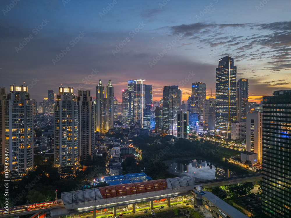 Fototapeta premium Drone Aerial View of Jakarta Downtown During Sunset