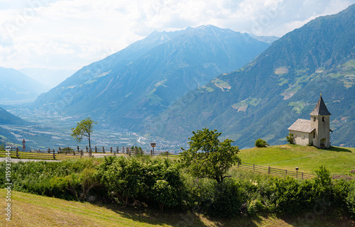 Die Kirche von Aschbach oberhalb von Algund mit Blick über Vinschgau. Südtirol, Italien. photo