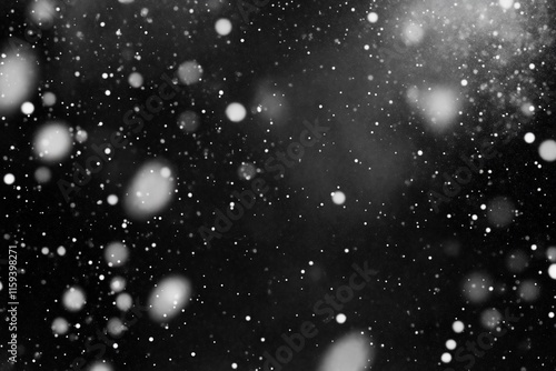 A monochrome background featuring floating particles resembling snow.