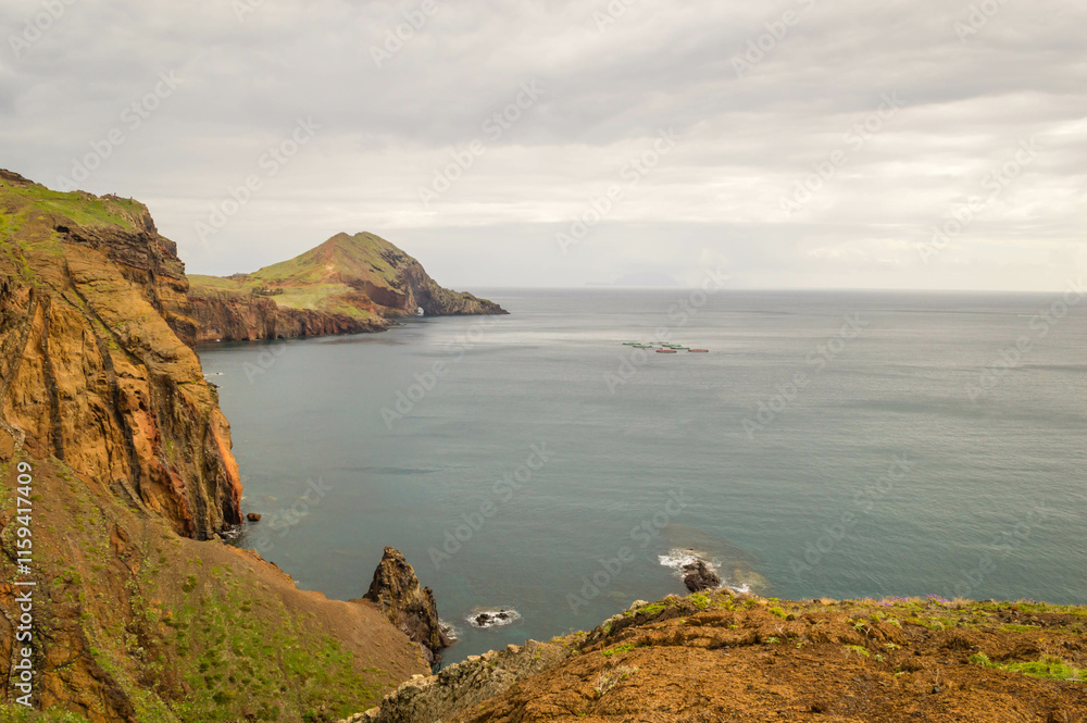 The majestic cliffs surrounded by blue waters. Vereda da Ponta de Sao Lourenco, Madeira, Portugal The majestic cliffs surrounded by blue waters. Vereda da Ponta de Sao Lourenco, Madeira, Portugal