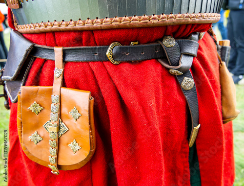 A purse and a knife in a sheath on the belt of a participant in the Rusborg historical reconstruction festival photo