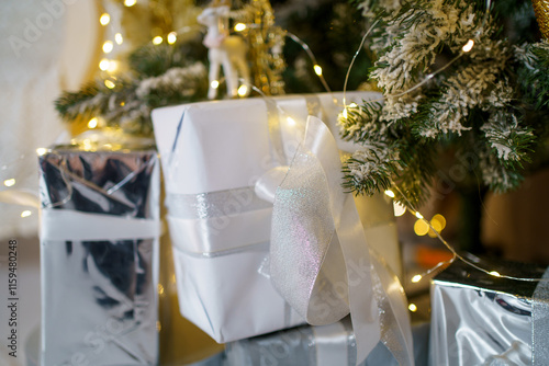 Decorated Christmas tree with sparkling lights and beautifully wrapped gifts in a cozy home setting during the holiday season